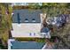 Aerial view showcasing the home's roofline and surrounding landscape at 15890 Sanctuary Dr, Tampa, FL 33647