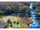 Aerial view of a putting green and lake at 15890 Sanctuary Dr, Tampa, FL 33647