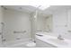 Accessible bathroom with walk-in shower and grab bars at 15890 Sanctuary Dr, Tampa, FL 33647