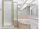 Bathroom features a shower and a large soaking tub at 15890 Sanctuary Dr, Tampa, FL 33647