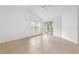 Bedroom with tile flooring, sliding glass door and a ceiling fan at 15890 Sanctuary Dr, Tampa, FL 33647