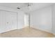 Bedroom with double door closet and ceiling fan at 15890 Sanctuary Dr, Tampa, FL 33647