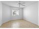 Empty bedroom with tile flooring and a ceiling fan at 15890 Sanctuary Dr, Tampa, FL 33647