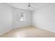 Empty bedroom with tile flooring and a ceiling fan at 15890 Sanctuary Dr, Tampa, FL 33647