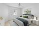 Bright bedroom with a ceiling fan and window coverings at 15890 Sanctuary Dr, Tampa, FL 33647