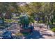 Gated community entrance with lush landscaping and brick pillars at 15890 Sanctuary Dr, Tampa, FL 33647