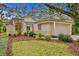 One-story house with a garage and well-manicured lawn at 15890 Sanctuary Dr, Tampa, FL 33647