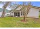 Charming house exterior with a screened porch and manicured lawn at 15890 Sanctuary Dr, Tampa, FL 33647