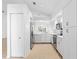 Bright kitchen with white cabinets, stainless steel appliances, and tile flooring at 15890 Sanctuary Dr, Tampa, FL 33647