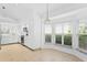Bright kitchen nook with a window seat and view to the backyard at 15890 Sanctuary Dr, Tampa, FL 33647