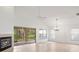 Living room with vaulted ceiling, fireplace and sliding doors at 15890 Sanctuary Dr, Tampa, FL 33647