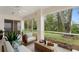Relaxing screened porch overlooking a lush backyard at 15890 Sanctuary Dr, Tampa, FL 33647