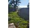 Backyard with lake view and wooden fence at 1632 28Th S Ave, St Petersburg, FL 33712