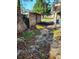 Side yard with damaged fence and debris at 1632 28Th S Ave, St Petersburg, FL 33712