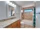 Bathroom with granite vanity and tiled shower at 1702 Horseshoe Dr, Plant City, FL 33566