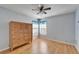 Bright bedroom with wood floors and large dresser at 1702 Horseshoe Dr, Plant City, FL 33566