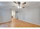 Large bedroom with wood flooring and ceiling fan at 1702 Horseshoe Dr, Plant City, FL 33566