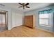 Bedroom with wood floors, closet, and dresser at 1702 Horseshoe Dr, Plant City, FL 33566