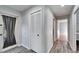 Hallway with tiled floor, closet, and access to rooms at 1702 Horseshoe Dr, Plant City, FL 33566