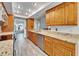 Kitchen with wood cabinets, granite countertops, and stainless steel appliances at 1702 Horseshoe Dr, Plant City, FL 33566