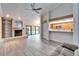 Spacious living room with a fireplace, built-in shelving and view of pool at 1702 Horseshoe Dr, Plant City, FL 33566