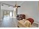 Living room with tile floors, recessed lighting, and view of the pool at 1702 Horseshoe Dr, Plant City, FL 33566