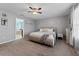 Main bedroom with neutral decor and ensuite bathroom access at 1737 Fox Grape Loop, Lutz, FL 33558