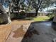 Backyard with concrete patio and trees at 19809 Wyndham Lakes Dr, Odessa, FL 33556