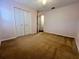 Bedroom with carpet, closet, and ceiling fan at 19809 Wyndham Lakes Dr, Odessa, FL 33556