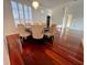 Elegant dining room with hardwood floors, chandelier, and a round table with six chairs at 19809 Wyndham Lakes Dr, Odessa, FL 33556