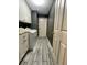 Laundry room with washer, dryer, cabinets and tiled floor at 19809 Wyndham Lakes Dr, Odessa, FL 33556