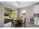 Breakfast nook featuring a modern chandelier and sliding glass doors to a patio at 19891 Bridgetown Loop, Venice, FL 34293