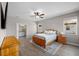 The main bedroom features two windows for natural light, and an ensuite bathroom at 19891 Bridgetown Loop, Venice, FL 34293