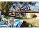 Relaxing backyard with rocking chairs and a small deck at 2005 E Crenshaw St, Tampa, FL 33610