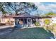 House with a screened porch and a large backyard at 2005 E Crenshaw St, Tampa, FL 33610