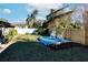 Backyard with a wooden deck and rocking chairs at 2005 E Crenshaw St, Tampa, FL 33610