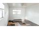 Spacious bedroom with large windows and partial flooring at 2005 E Crenshaw St, Tampa, FL 33610
