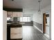 Kitchen features white cabinets, granite countertops, and a breakfast bar at 2005 E Crenshaw St, Tampa, FL 33610
