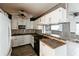Modern kitchen with white cabinets and granite countertops at 2005 E Crenshaw St, Tampa, FL 33610