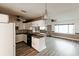 Updated kitchen with white cabinets and breakfast bar at 2005 E Crenshaw St, Tampa, FL 33610