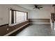 Spacious living area with hardwood floors and large window at 2005 E Crenshaw St, Tampa, FL 33610