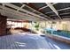 Relaxing screened porch with white wood floors and backyard view at 2005 E Crenshaw St, Tampa, FL 33610