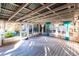 Bright screened porch with white wood floors and backyard access at 2005 E Crenshaw St, Tampa, FL 33610