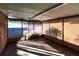 Bright sunroom with bamboo shades and tiled floor at 2005 E Crenshaw St, Tampa, FL 33610