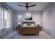 Cozy bedroom with wood furniture and ceiling fan at 2550 1St N Ave, St Petersburg, FL 33713