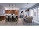 Modern kitchen with island, dining area, and wood cabinets at 2550 1St N Ave, St Petersburg, FL 33713
