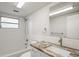 Bathroom with a shower/tub combo, granite countertop, and updated fixtures at 3403 Overland Dr, Holiday, FL 34691
