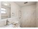 Updated bathroom with a shower, granite countertop, and modern fixtures at 3403 Overland Dr, Holiday, FL 34691