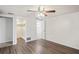 Spacious bedroom with a large closet and wood-look floors at 3403 Overland Dr, Holiday, FL 34691