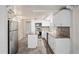 Updated kitchen with white cabinets, granite countertops and island at 3403 Overland Dr, Holiday, FL 34691